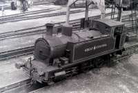 Scene at Steamtown, Carnforth, in 1975. Preserved 0-6-0T in GCR livery - details unknown.<br><br>[Colin Miller //1975]
