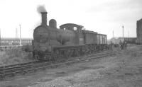 Holden J15 0-6-0 no 65445 seen pottering about in the yards at Stratford in October 1961. The 1899 veteran was finally withdrawn from here the following August.<br><br>[K A Gray 09/10/1961]
