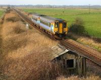 A train for Great Yarmouth approaching Stracey Arms, near Acle, Norfolk, in February 2006.<br><br>[Ian Dinmore /02/2006]