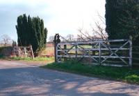 The old level crossing gates at Maxton in 1998 looking west towards St Boswells. [See image 19679]<br><br>[Ewan Crawford //1998]