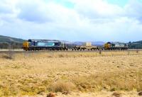 DRS class 37s nos 37259 and 37608 top and tail the nuclear flask train across the moors at Moy on the way north to Georgemas Junction on 1 May 2013.<br><br>[John Gray 01/05/2013]
