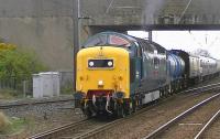 Deltic D9000 <I>Royal Scots Grey</I> with the 6Z54 Brodie Works to Glasgow Works EMU drag, seen leaving Barassie sidings with 334025 in tow shortly after running round.<br><br>[Ken Browne 04/05/2013]