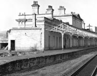 By the end of the 1970s / early 1980s when this photograph was taken, the fine range of buildings at Halifax no longer served the needs of passengers and was boarded up, presenting a less than appealing image of the railway. Since then it has been restored with part of it in use as a nursery. <br><br>[Bill Jamieson //]