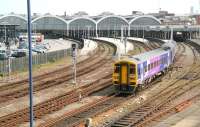 A 158 leaving Hull in April 2009. Note the 'surplus to requirements' section of the station on the left converted to accommodate part of a bus interchange.<br><br>[John Furnevel 23/04/2009]