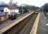 The Spondon station building (red brick) and station master's house (rendered, and complete with stopped clock) have both been converted to new uses in this view towards Nottingham in February 2013. The train is a Nottingham - Matlock service [see image 40786].<br><br>[Ken Strachan 21/02/2013]