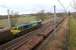 Freightliner 66520 heads north passed Oxheys Loop with empty coal wagons to Killoch from Fiddler's Ferry Power Station on 14 March 2013. In the loop are a number of single and double deck car carriers which had been removed from the 6O15 Mossend to Eastleigh freight in the early hours of 13 March.<br><br>[John McIntyre 14/03/2013]