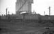 Fowler 7F 0-8-0 no 49592 stands alongside the coaling plant on Bolton shed in the late 1950s. The locomotive was finally withdrawn from Newton Heath in May 1959.<br><br>[K A Gray //]