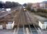 View west at Spondon towards Derby on 21 February [see image 42222] in an area full of history. The Derby-Nottingham canal survives as a path beyond the flats on the right; while the East entrance to Chaddesden yard was just beyond the road bridge (Raynesway) in the distance. The sidings on the left serve the Celanese works, which is under threat of 'lift and shift' to China. Finally, the grey gate on the left used to access a sizeable signalbox. The approaching DMU is heading for Nottingham.<br><br>[Ken Strachan 21/02/2013]