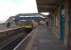 A CrossCountry Turbostar bound for Nottingham passes through Chepstow non-stop on 31st March 2013. The driver smiled as I juggled snack storage and photography. The former goods shed can be seen beyond the footbridge.<br><br>[Ken Strachan 31/03/2013]