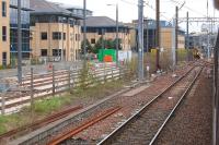 Approaching Haymarket by train on 6 May, with the tramway on the left (with loop) and 156506 standing in platform 0.<br><br>[Bill Roberton 06/05/2013]