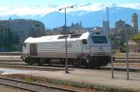 Stabled in the sidings adjacent to the platforms at Granada on 1 May is a RENFE class 334 Bo-Bo diesel electric locomotive. The snowcapped Sierra Nevada mountains form the backdrop.<br><br>[Andrew Wilson 01/05/2013]