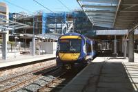 The changing face of Haymarket. View west on 17 May 2013 as the East Coast 09.52 Aberdeen - London Kings Cross HST runs into platform 1. <br><br>[John Furnevel /05/2013]