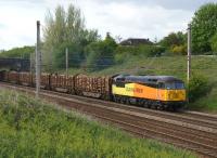 Colas Rail Freight 56302 hauls 17 loaded timber wagons from Carlisle to Chirk on 24 May 2013 just south of Farington Curve Junction on the WCML.<br><br>[John McIntyre 24/05/2013]