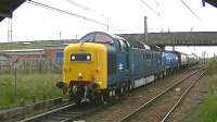 Deltic D9000 <I>Royal Scots Grey</I> leaves Barassie sidings on 4 May 2013 with the Kilmarnock Works to Glasgow Works EMU drag transferring unit 334025.<br><br>[Ken Browne 04/05/2013]