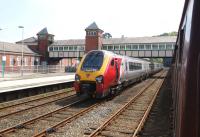 A Virgin Voyager stands on the up main line at Bangor on 29 May 2013 having arrived earlier with the 0810 from London Euston. It will soon move into the adjacent up platform and form the 1224 back to Euston.<br><br>[John McIntyre 29/05/2013]
