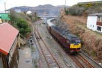 The Royal Scotsman leaves Kyle passing the recently renovated signalbox (museum and holiday accommodation).<br><br>[Ewan Crawford 27/04/2013]