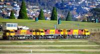 The only railway remnants in Hobart are a container yard and a general yard. Here, a trio of locos delivered in 2012 (the first new to Tasrail since 1973) depart after shunting the container yard. There is a grandstand just off camera for viewing yacht racing, with grass terraces for spectators. The unfenced rail line runs right through these terraces!<br>
<br><br>[Colin Miller 15/05/2013]