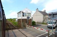 Passing Gaerwen SB, Anglesey, on a westbound train in May 2013. This was the junction of the branch to Amlwch and although the track is still in place on the branch, the old connection to the mainline (just beyond the SB) has been removed. Gaerwen station, closed in 1966, also stood here.<br><br>[John McIntyre 29/05/2013]