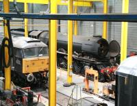 <h4><a href='/locations/N/National_Railway_Museum_York'>National Railway Museum York</a></h4><p><small><a href='/companies/N/National_Railway_Museum'>National Railway Museum</a></small></p><p>General view over the workshops at the National Railway Museum in June 2013. The locomotive hiding at the back, disguised in wartime black livery and carrying the number 502 is <I>Flying Scotsman</I>. See image <a href='/img/26/937/index.html'>26937</a>   77/132</p><p>06/06/2013<br><small><a href='/contributors/John_Furnevel'>John Furnevel</a></small></p>