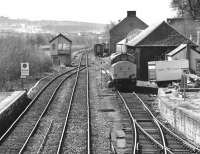 View south from the footbridge at Dingwall on 31 March 1989.  37417 <I>Highland Region</I> is receiving attention in the former goods yard while a Mk1 coach and 156 unit are stabled beyond.  Taken during the isolated operation of the Far North line due to collapse of the Ness Viaduct.<br><br>[Bill Roberton 31/03/1989]