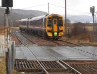 A Kyle to Inverness Sprinter service approaching Strathcarron on a wet and overcast 14 March 2013.<br><br>[Brian Smith 14/03/2013]
