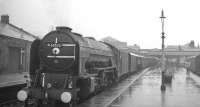 A downpour at Stirling during what is thought to be the final week of steam operations on the Aberdeen - Buchanan Street route in 1966. A2 Pacific no 60532 <I>Blue Peter</I>  is waiting to depart with the 1.30pm ex-Aberdeen.<br><br>[K A Gray //1966]