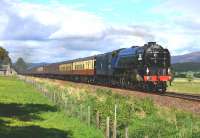 Painted in early B.R.Express Passenger Blue, A1 Pacific No 60163 Tornado hauls the <I>Cathedrals Express</I> south on 15 June passing Balavil Cottage near Kingussie.<br><br>[John Gray 15/06/2013]