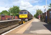 Following servicing at Carnforth, 47854 brings the ECS for the Compass Tours return charter to North Berwick back towards Morecambe through Bare Lane station on 15 June. [See image 43442]<br><br>[John McIntyre 15/06/2013]