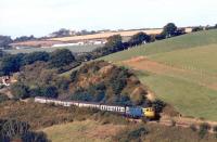 The 11.10 from Barnstaple to Waterloo photographed near Coleford Junction in the 1980s.<br><br>[Ian Dinmore //]