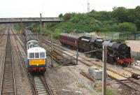 Having changed locos at Farington Junction on 20 June, the return <I>Cumbrian Mountain Express</I> snakes out onto the WCML behind 86259 <I>Les Ross</I> on its way back to Euston. On the right is 46115 <I>Scots Guardsman</I> which had hauled the train from Carlisle and was waiting to return home to Carnforth.<br><br>[John McIntyre 20/06/2013]