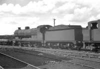 Steam locomotives stored in the yard at Horwich works in June 1963 include class O4 2-8-0 63695 (withdrawn Sheffield Darnall 12/62) and 3F 0-6-0T 47281 (withdrawn Carlisle Kingmoor 3/63).<br><br>[K A Gray 22/06/1963]