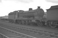 Class O4 2-8-0 no 63707 in the sidings alongside Langwith Junction shed, probably taken in 1959. The locomotive was eventually withdrawn from Colwick in 1965.<br><br>[K A Gray //1959]