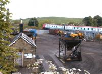 A southbound Voyager passing the goods yard at Alnmouth in May 2004 shortly after leaving the station.<br><br>[John Furnevel 26/05/2004]