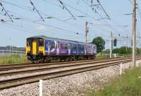 A Northern Class 150 heads past the Leyland Trucks site approaching Farington Junction on 6 July 2013 with a service to Blackpool.<br><br>[John McIntyre 06/07/2013]