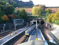 Princes Street Gardens taking on Autumn colours in early October 2005 as a train from Glasgow Queen Street leaves The Mound tunnel and enters Waverley station. <br><br>[John Furnevel 12/10/2005]
