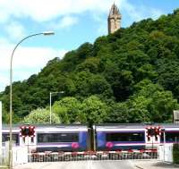 Waterside level crossing at Causewayhead, just to the east of Stirling. Scene in June 2008, some 3 weeks after recommencement of passenger services between Alloa and Stirling. Speeding east over the crossing is the 1218 Glasgow Queen Street - Alloa. [See image 56554]<br><br>[John Furnevel 12/06/2008]