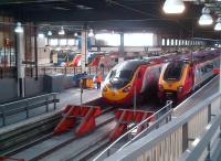 All systems go at Euston station during the evening rush hour on 12 July 2013, with two Voyagers sandwiching two Pendolinos at the platforms.<br><br>[Ken Strachan 12/07/2013]