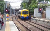 A train for Stratford arriving at Highbury and Islington from the west on 20 July 2013.<br><br>[John Thorn 20/07/2013]