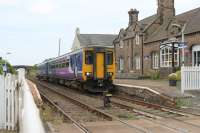 156426, on a Carlisle to Barrow service, calls at the Drigg request stop on the Cumbrian Coast line. The station building is now used as a craft and coffee shop. The rail served BNFL facility at Drigg lies alongside the station.<br><br>[Mark Bartlett 27/07/2013]