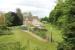 Humshaugh opened as Chollerford but was later renamed after the larger, but more distant, village of that name. Closed with the Border Counties line in 1956, this view looks north towards Reedsmouth over the old station, now a private residence.<br><br>[Mark Bartlett 05/06/2013]