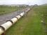 The view east from the A99 south of Keiss [see image 43540] on 22 June 2013, looking towards the pipe welding facility and Sinclairs Bay beyond. <br><br>[David Pesterfield 22/06/2013]