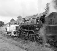 Having arrived at Keith Town as the 16:15 from Dufftown, Ivatt class 2 46512 and its train of dmus are propelled back along the running line to Strathmill Distillery Siding by EE 0-6-0 DM <I>Spirit o' Fife</I>. Here the 2-6-0 will be released into the siding, allowing the coaches to be taken back to the station by the diesel shunter.<br><br>[Bill Jamieson 13/10/2012]