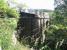 The attractive bridge that once carried trains across the Lyne Water into Lyne Station. Looking east on 8 July 2013. The old station building (now a private residence) stands off to the left.<br><br>[John Yellowlees 08/07/2013]