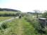 The bridge over the Lyne Water on the approach to Lyne station in July 2013. View is east, back towards Peebles. [See image 43800]<br><br>[John Yellowlees 08/07/2013]