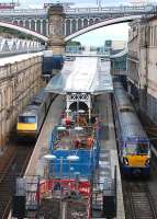 Work continues on the southernmost platforms at Waverley Station on 1 August, with 91009 and 334036 awaiting departure.<br><br>[Bill Roberton 01/08/2013]