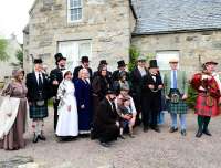 Some of the guests involved in the Strathspey Railway celebrations on 3 August 2013 [see image 44056] posing for photographs outside Grantown Museum in Victorian costume prior to the official opening. An exhibition about the railway is currently running here.<br><br>[John Gray 03/08/2013]