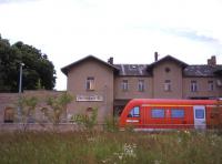 <i>Last stop for Sherlock Holmes!</i> Reichenbach (Sachsen) is one of five towns of this name in Germany. While the quality of trains throughout Germany is almost universally good (and outstanding in the case of the ICE units), much of the railway environment around small to medium-sized stations in the old East is neglected and unattractive. Reichenbach is no exception, with the boarded-up graffiti-adorned building and overgrown former goods yard forming a dismal backdrop for a Dresden-Goerlitz Regionalbahn service on 3rd July 2013.<br><br>[David Spaven 03/07/2013]