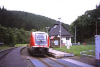 On 29th June 2013, a Schwartzatalbahn branch train arrives at the Katzhuette terminus of the 25km branch line from the Rottenbach junction on the Saalfeld-Erfurt line in Thuringen. The single-car VT641 diesel unit is a driver-only operation, with a ticket machine on the train. The grid in the foreground and the container to the right are part of a small refuelling point.<br><br>[David Spaven 29/06/2013]