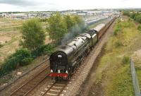 Britannia Pacific 70013 <I>Oliver Cromwell</I> hauls the second leg of the train commemorating the 45th anniversary of the <I>15 Guinea Special</I> from Manchester to Carlisle through Buckshaw Parkway station on 11 August 2013. Known to many as 1T57 - the reporting code used by the original train and also by this charter. [See image 26044]<br><br>[John McIntyre 11/08/2013]