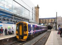 The east end of platform 1 at Haymarket on 9 August 2013, with the departing 11.00 Perth - Edinburgh Waverley about to enter Haymarket tunnel.<br><br>[John Furnevel 09/08/2013]